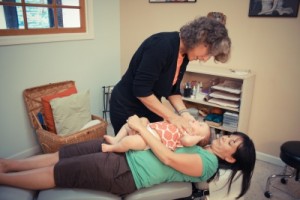 Dr Horner adjusting an infant